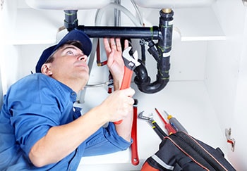 Professional Plumber Doing Sink Reparation