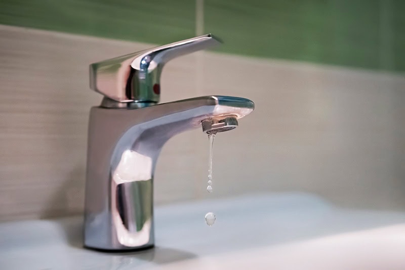 5 Plumbing Problems Costing You Money. A dripping faucet.