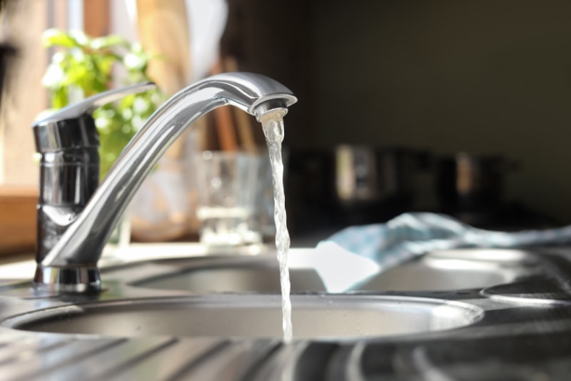 Why Is My Garbage Disposal Humming? Water running from tap into kitchen sink.