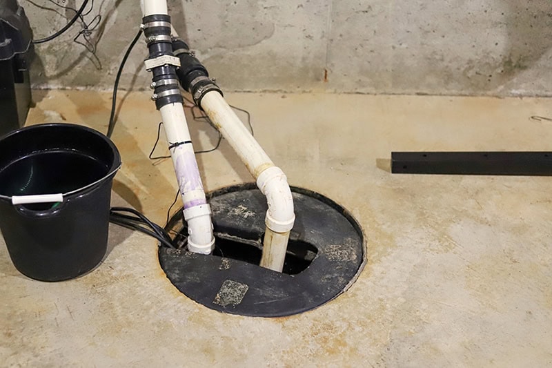2025 Sump Pump Buying Guide. A sump pump in a home basement.